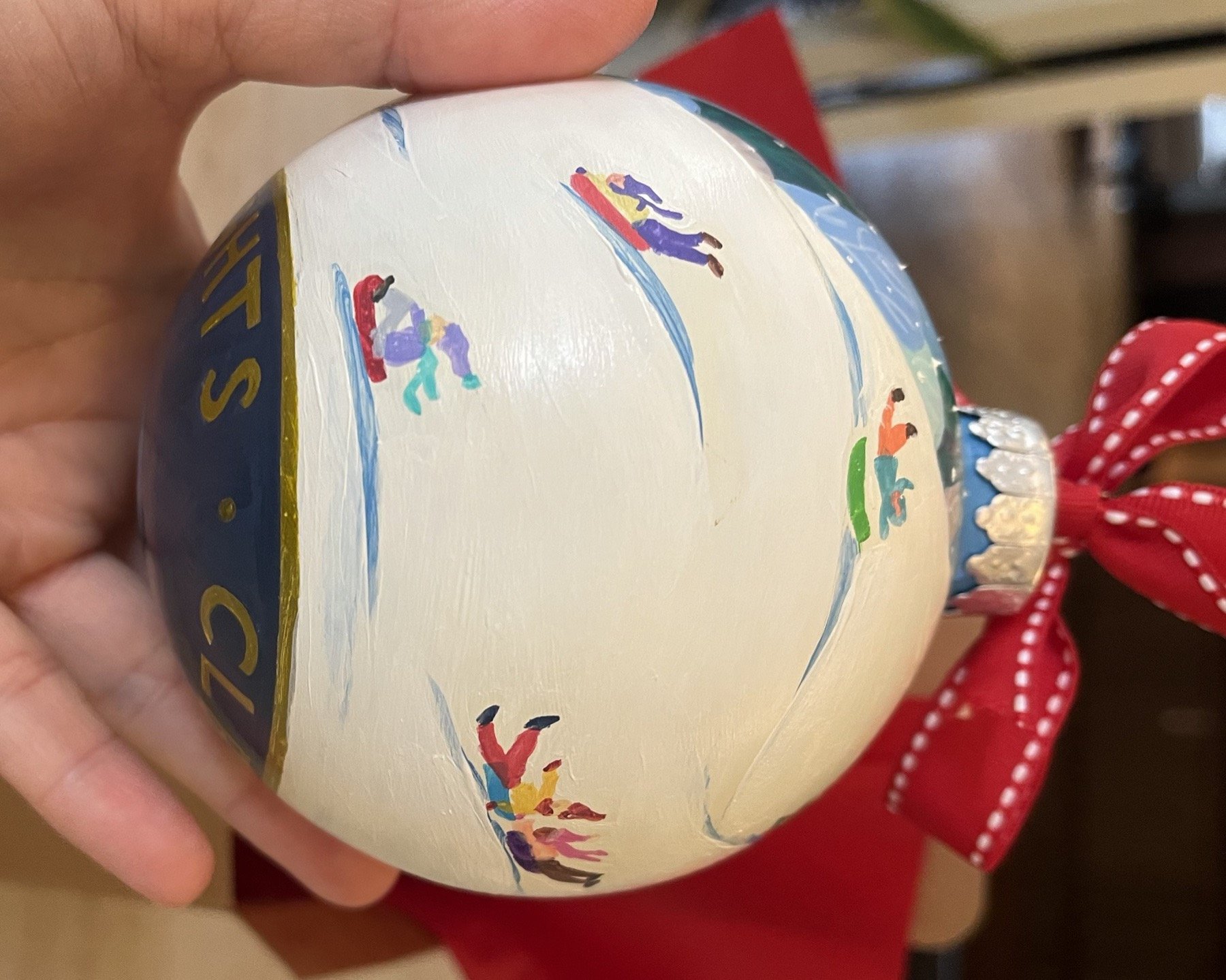 Hand-painted Cleveland Heights ornament with tiny winter figures