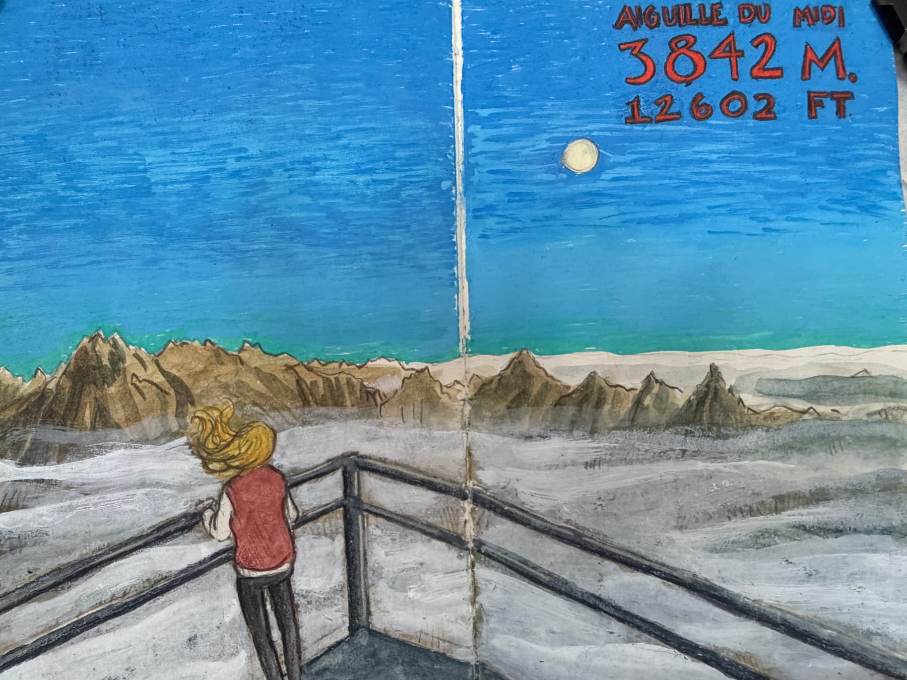A traveler looks across the snow-covered Alps from Aiguille du Midi